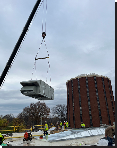 Crew Installing Commercial AC Unit on Building using Crane