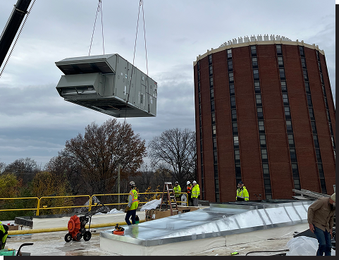 Crew Installing Commercial AC Unit on Building using Crane